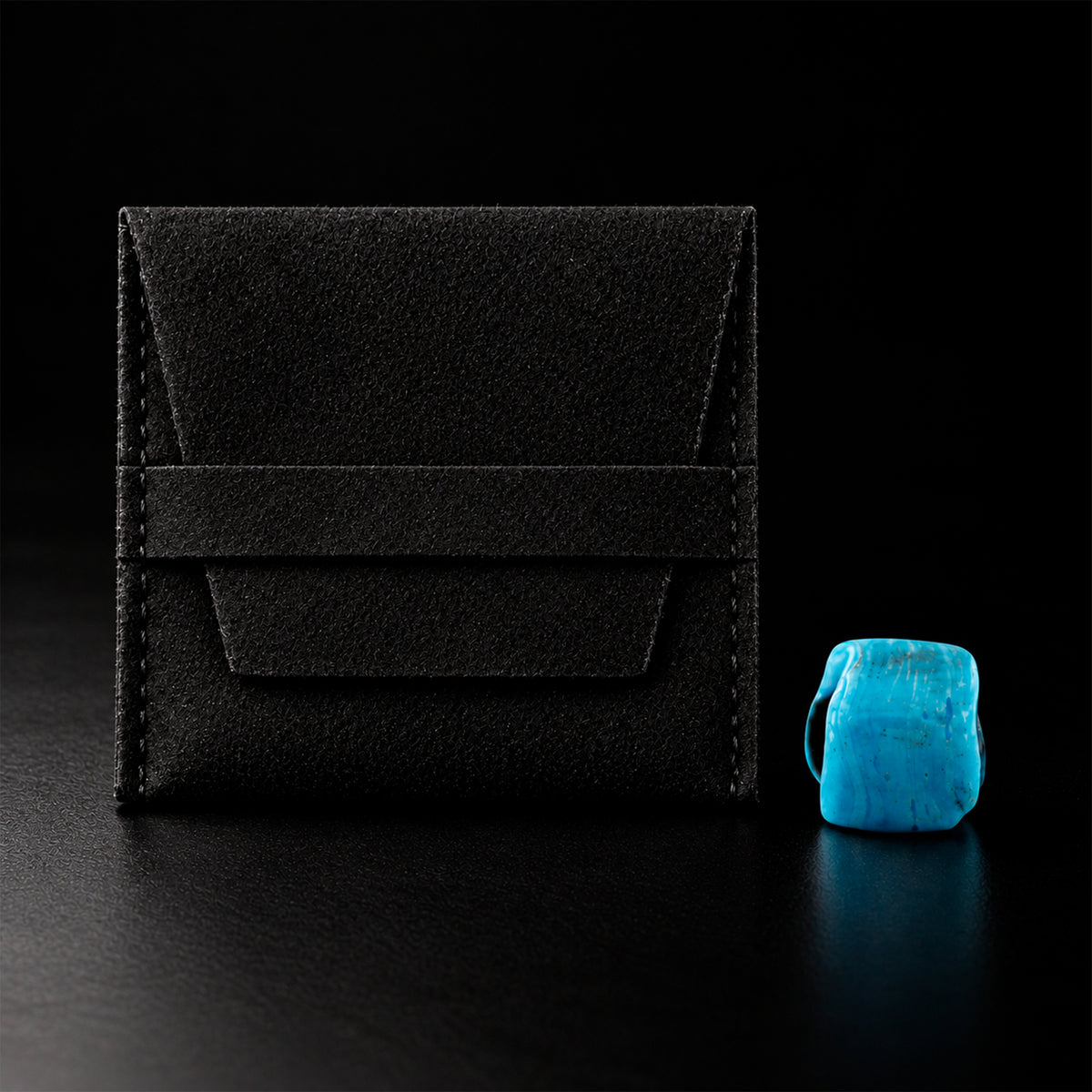 Dije Piedra Caribe dentro de pouch negro con presentación premium.